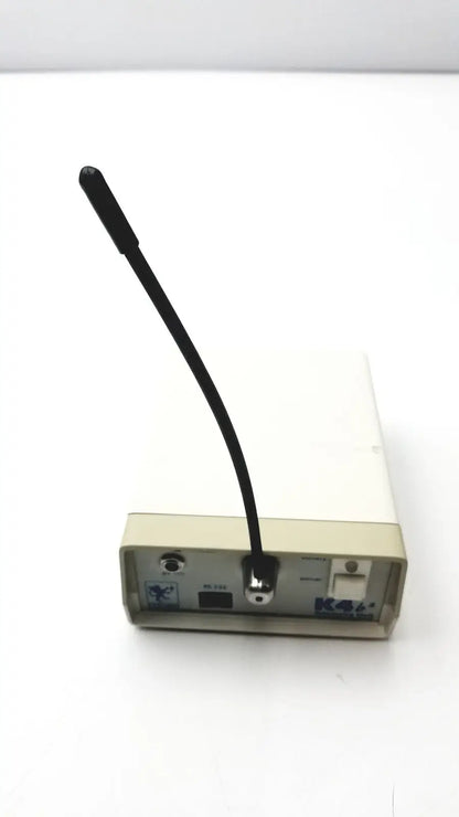 Beige rectangular Cosmed K4 B2 metabolic electronic device with black flexible antenna for reuse medical applications