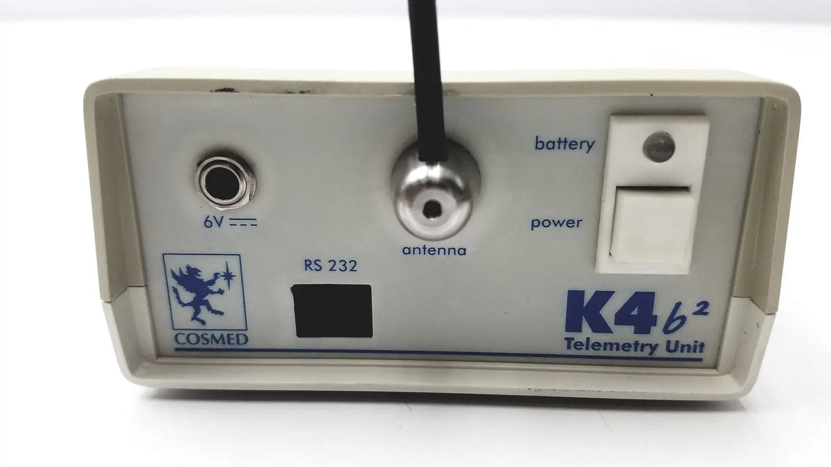 Beige plastic cosmed k4 b2 metabolic telemetry unit with silver antenna port and power switch for reuse medical applications