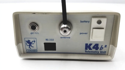 Beige plastic cosmed k4 b2 metabolic telemetry unit with silver antenna port and power switch for reuse medical applications