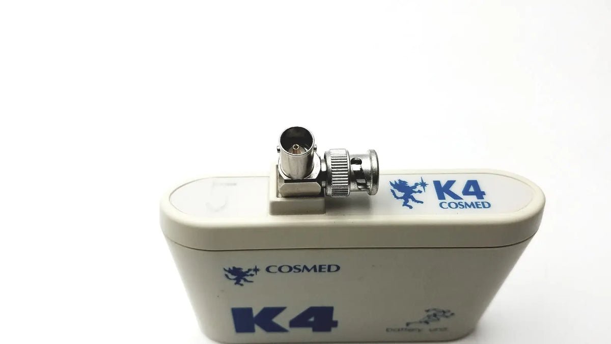 Beige cosmed k4 b2 metabolic portable heart rate monitor with blue branding and metallic bnc connector for reuse medical use