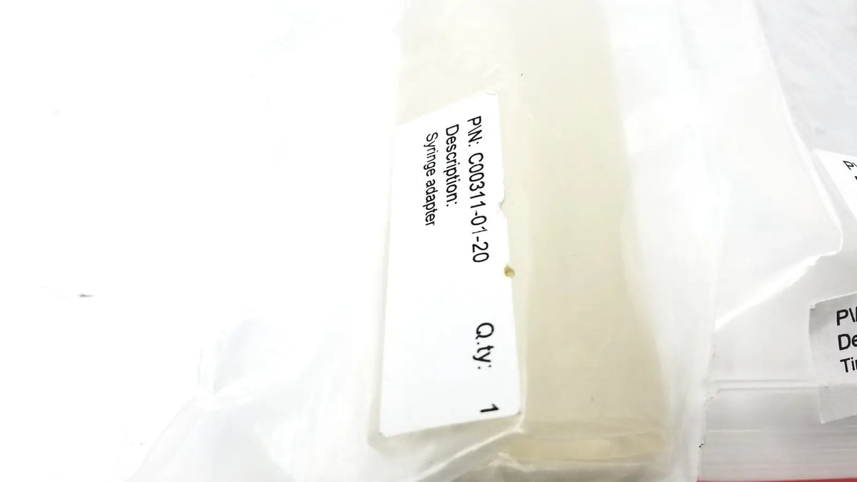 Clear plastic syringe adapter in transparent packaging bag labeled c00311-01-20 for reuse medical cosmed k4 b2 metabolic product