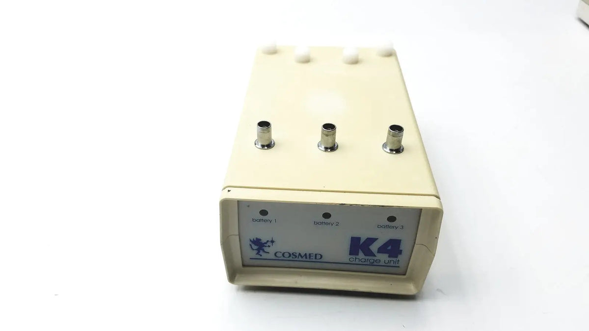 Cream-colored cosmed k4 b2 metabolic exercise monitor with three metallic ports and battery indicators for reuse medical use