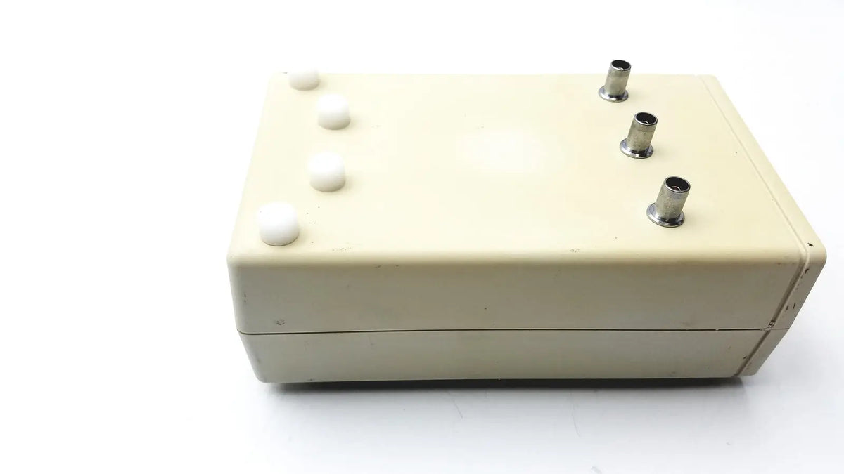 Cream-colored Cosmed K4 B2 metabolic electronic device with four white push buttons and three metallic ports for reuse medical use