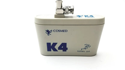 Cream-colored cosmed k4 b2 metabolic battery unit with blue branding and metallic bnc connector for reuse medical purposes