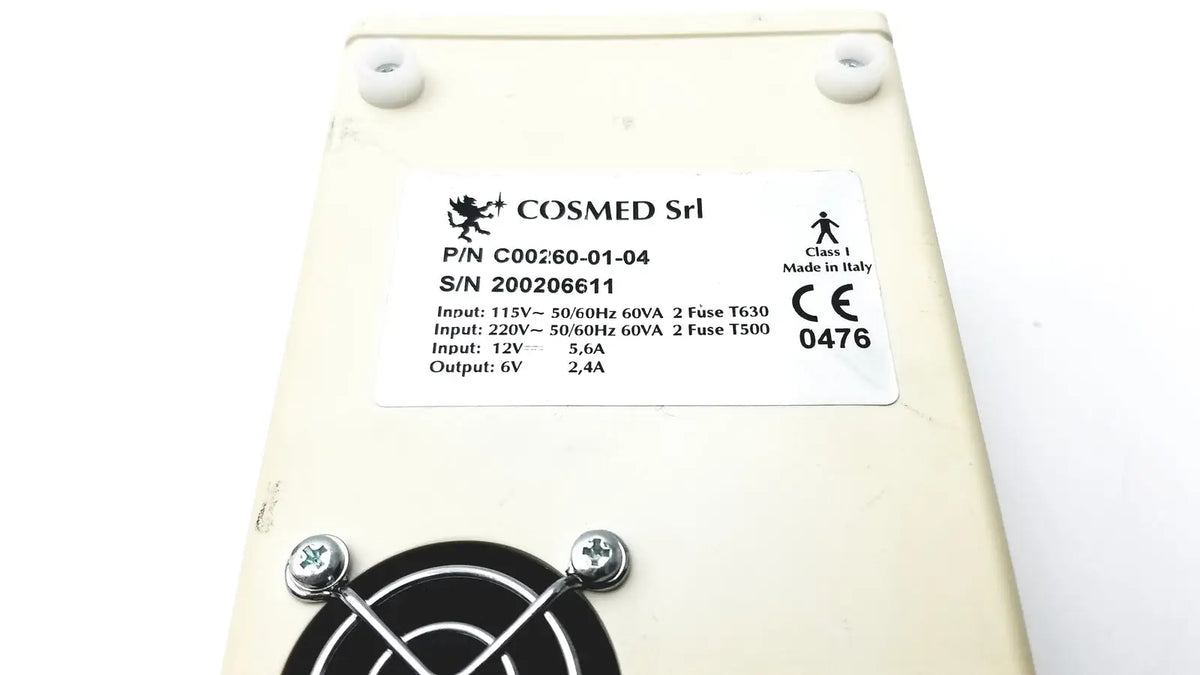 Cream-colored rectangular power supply unit for cosmed k4 b2 metabolic with technical specs label for reuse medical use