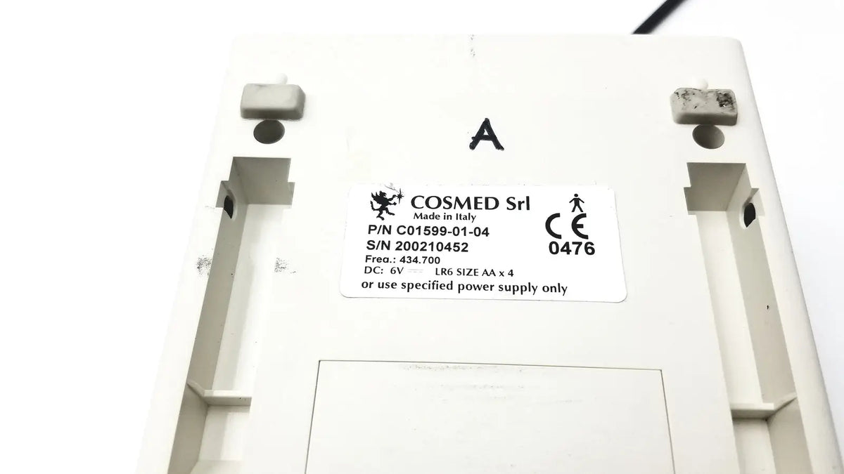 White plastic cosmed k4 b2 metabolic device back showing made in Italy label and four AA battery requirement for reuse medical