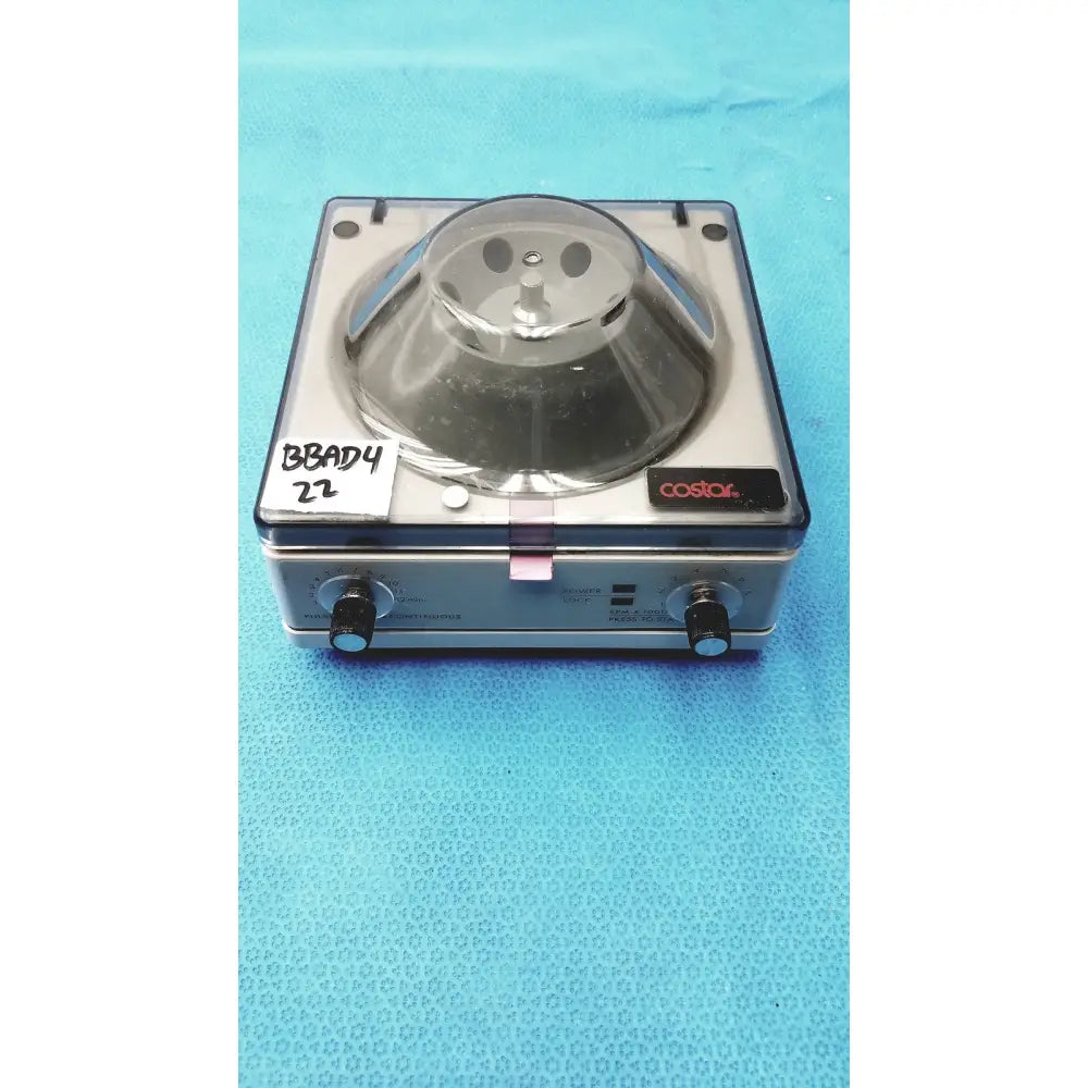 Silver and black costar mini centrifuge with clear glass rotor chamber and fixed angle 6-position rotor