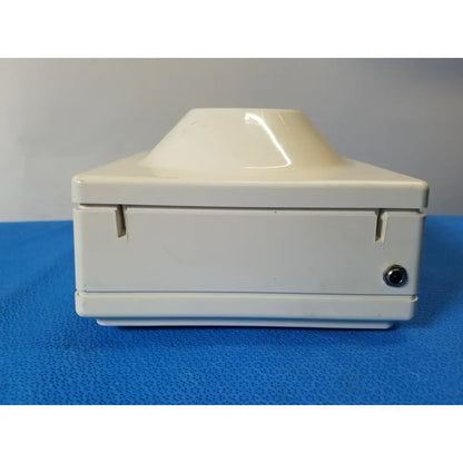 Cream-colored plastic Costar Model 10 mini centrifuge with fixed position angled rotor and two side latches