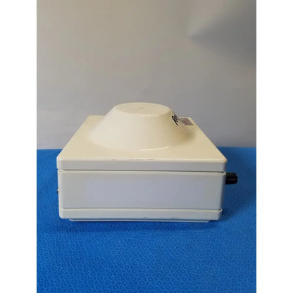 Cream-colored Costar Model 10 mini centrifuge with fixed position angled rotor and black control knob for laboratory use