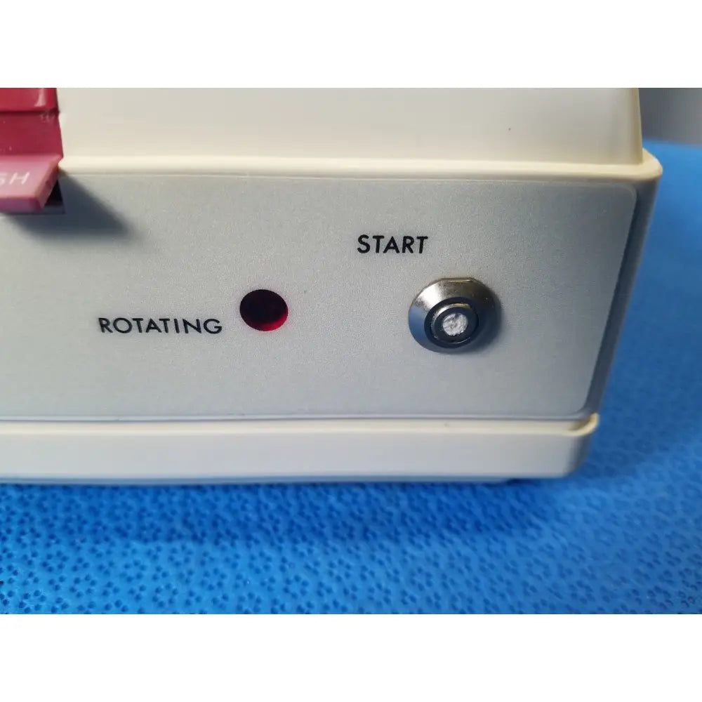 White plastic Costar model 10 mini centrifuge with fixed position angled rotor red rotating light and silver start button