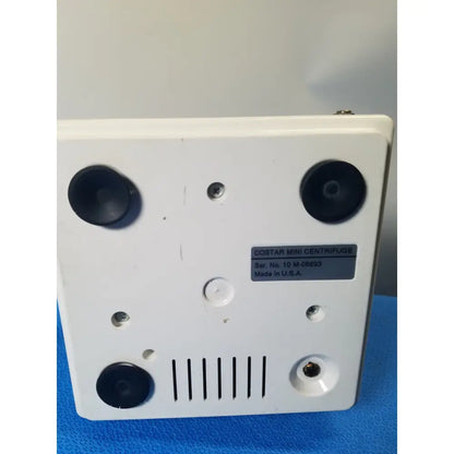 White plastic costar model 10 mini centrifuge with black fixed position angled ports and serial number label visible