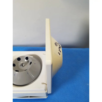 Costar model 10 mini centrifuge with white plastic body, silver metallic fixed position angled rotor, and labeled side panel