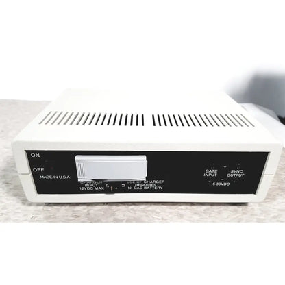 White rectangular coulbourn bio system calibrator with black control panel featuring labeled switches and input output ports