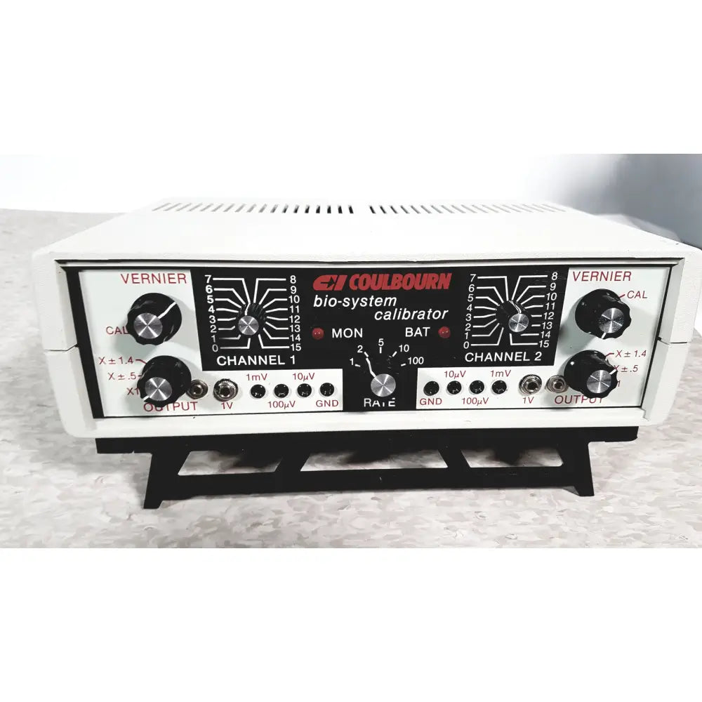 White plastic coulbourn bio system calibrator with black control panel, silver knobs, and red labeling for reuse medical use