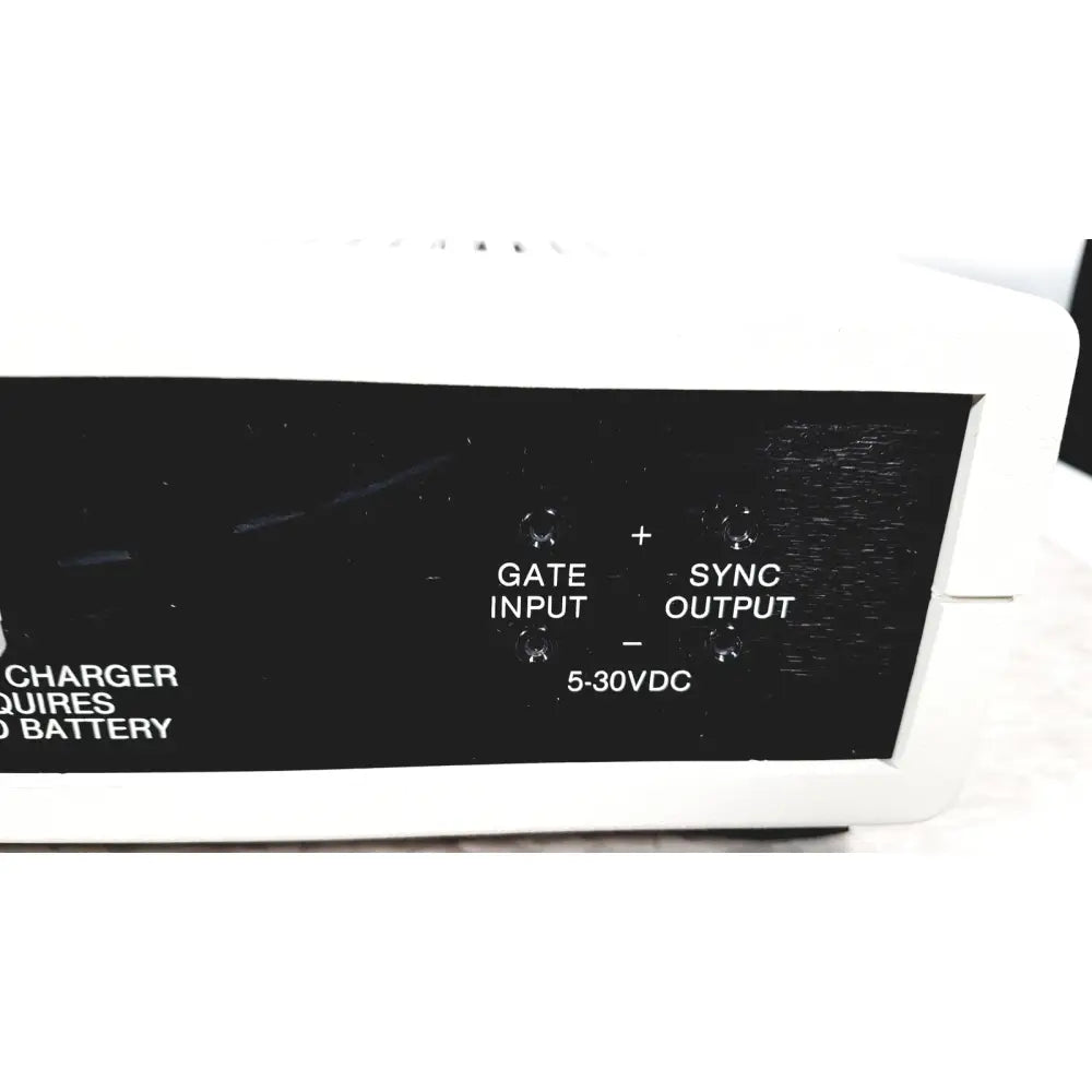Back side of white plastic coulbourn bio system calibrator with black panel labeled gate sync and voltage input output ports for reuse medical use