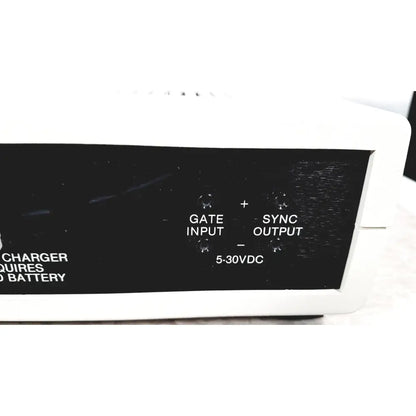 Back side of white plastic coulbourn bio system calibrator with black panel labeled gate sync and voltage input output ports for reuse medical use