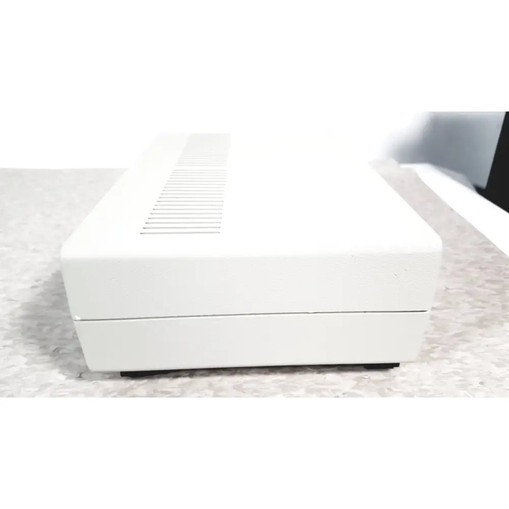 White rectangular electronic device with textured surface and ventilation slits top coulbourn z13-22 stimulator