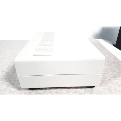 White rectangular electronic device with textured surface and ventilation slits top coulbourn z13-22 stimulator