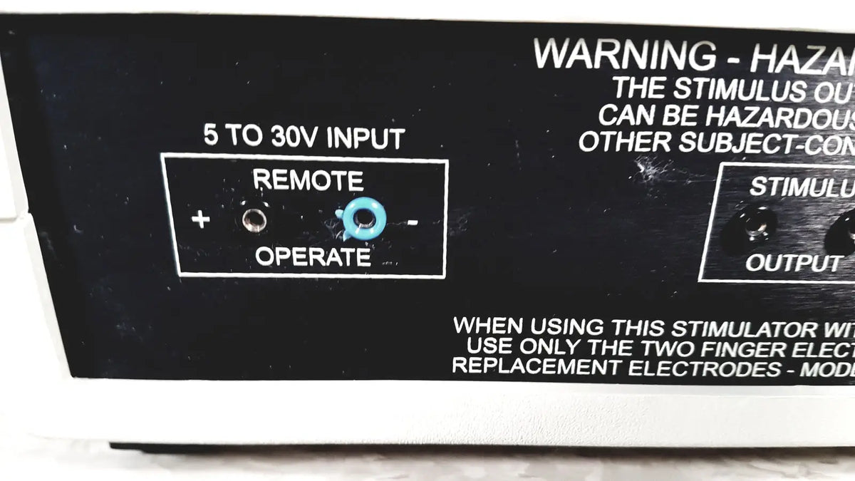 Black coulbourn z13-22 stimulator panel with white labeling and light blue knob labeled remote operate