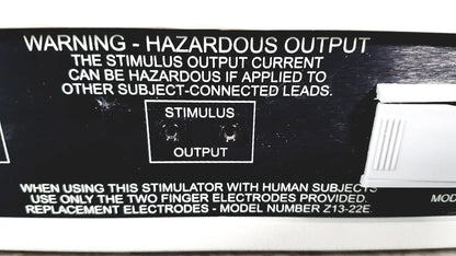 Black plastic output panel of coulbourn z13-22 stimulator with white text and two circular stimulus output ports