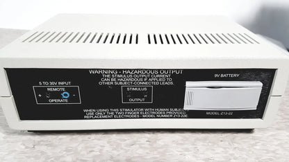 White rectangular coulbourn z13-22 stimulator device with black label and silver battery compartment model z13-22