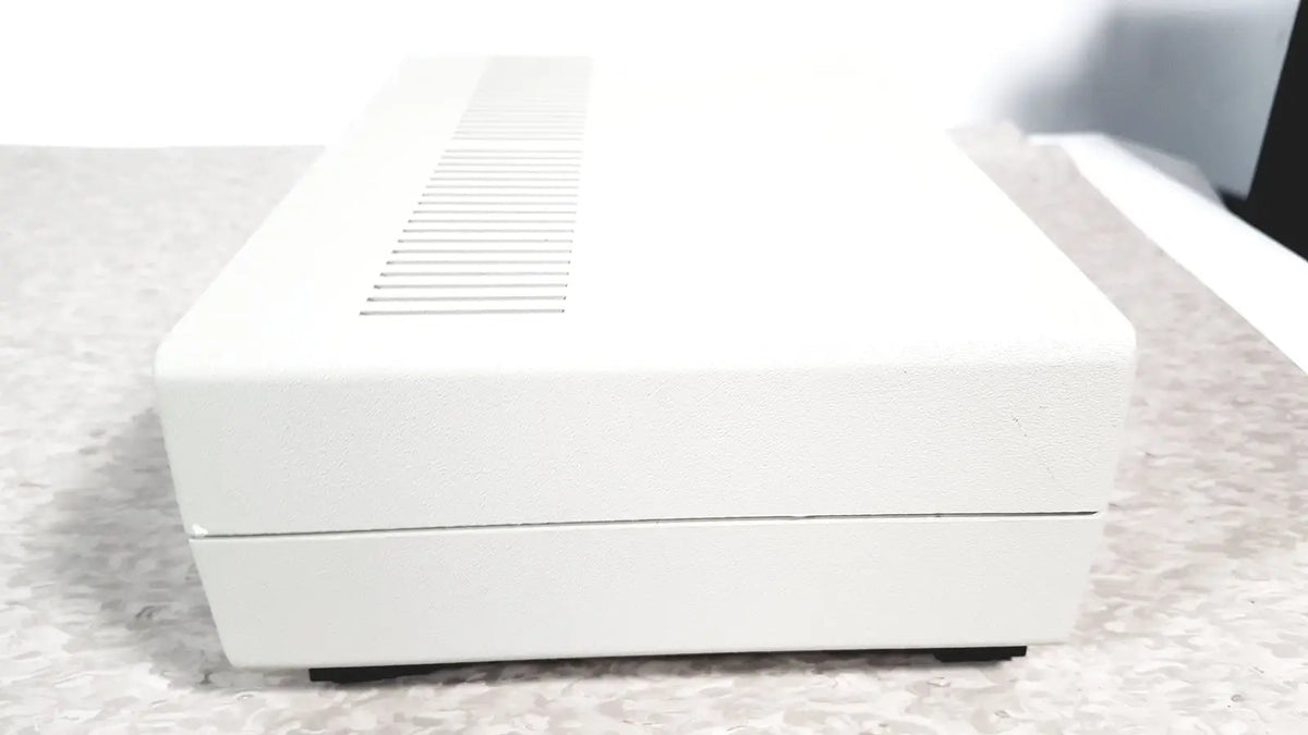 White rectangular electronic device with textured surface and ventilation slits top coulbourn z13-22 stimulator