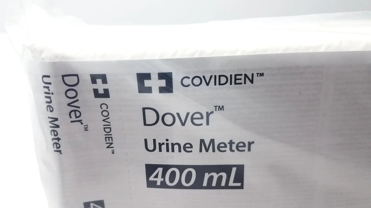 Covidien 2000 dover urine meter 400ml capacity in white plastic bag with black printed branding and measurement markings