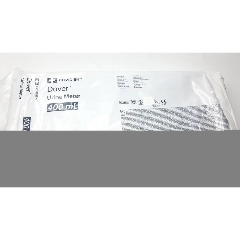 White plastic package containing a covidien dover urine meter 400ml for accurate fluid measurement in medical settings