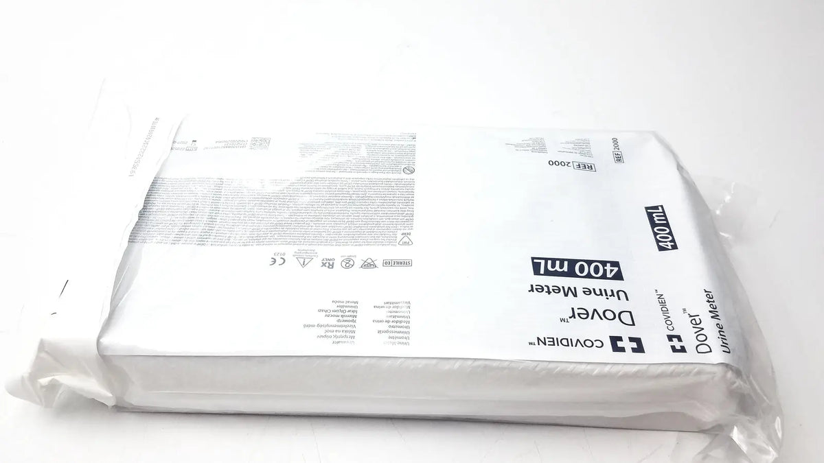 White plastic package containing a covidien dover urine meter 400ml for accurate urine measurement