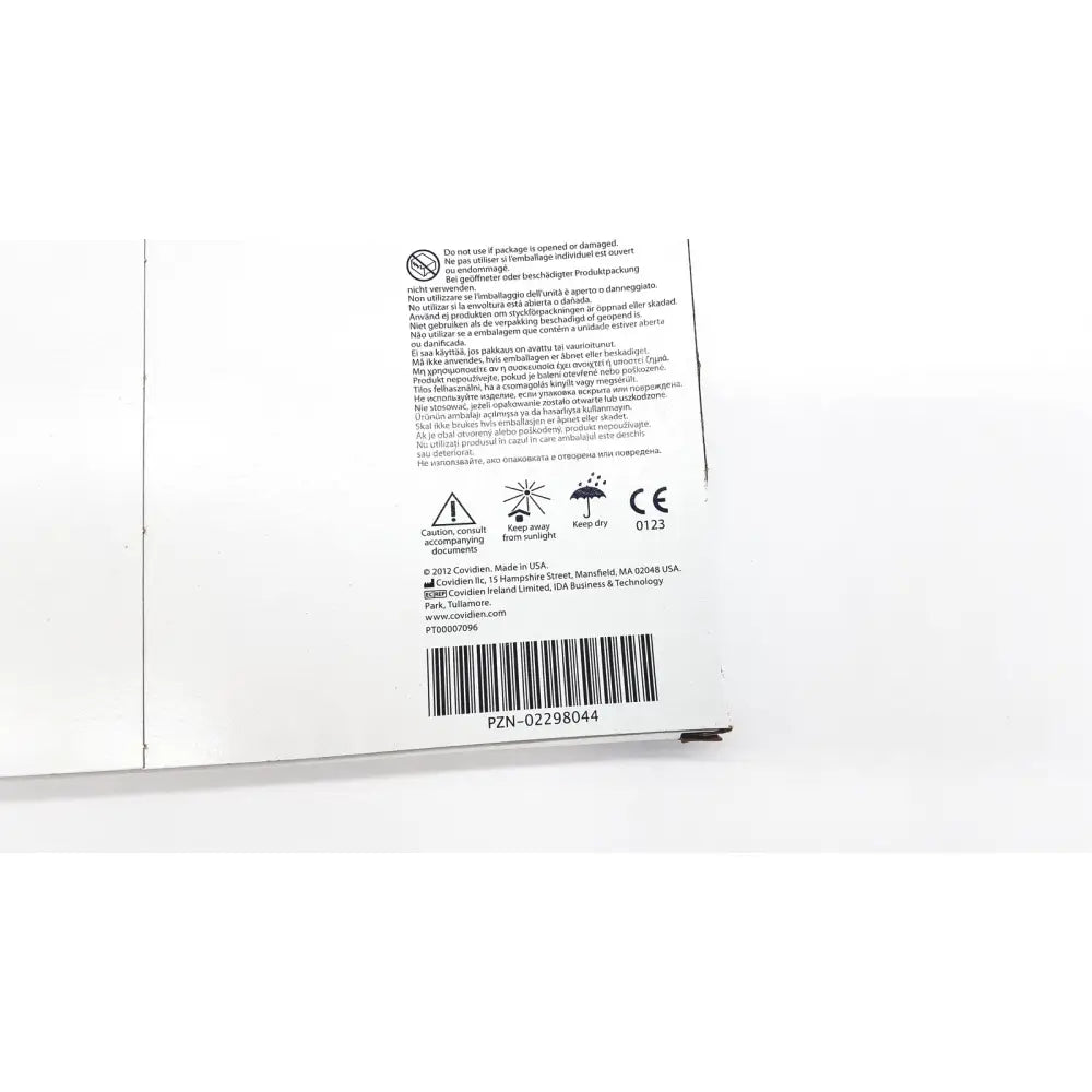 White cardboard packaging backside of covidien 6648kendall transparent film dressing with multilingual safety warnings and barcode