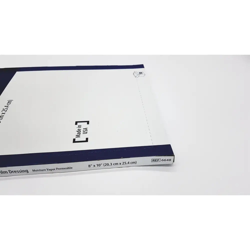 White and navy blue covidien 6648kendall transparent film dressing package with dimensions and reference number visible