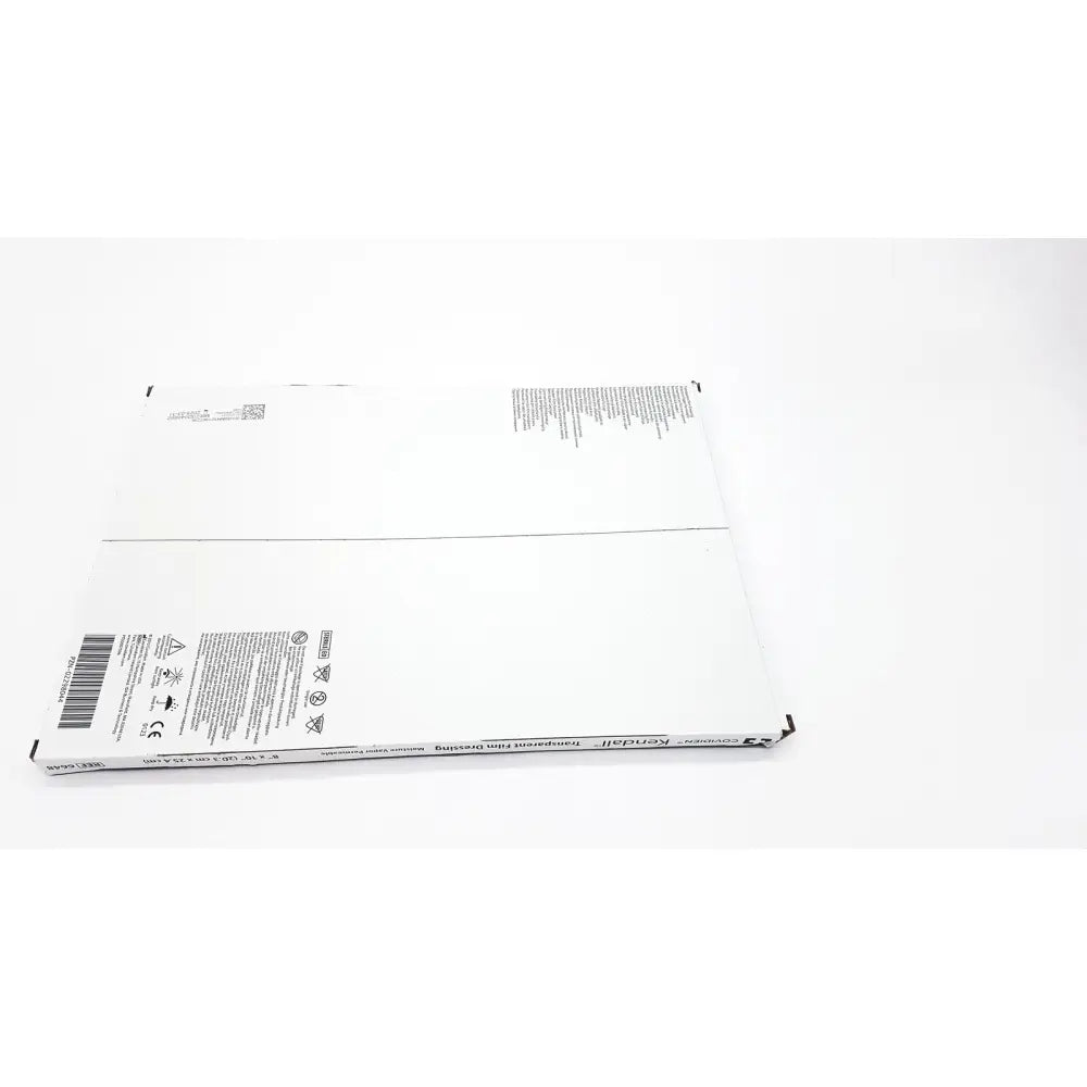 White rectangular cardboard box of covidien 6648kendall transparent film dressing 8x10 with black text and symbols