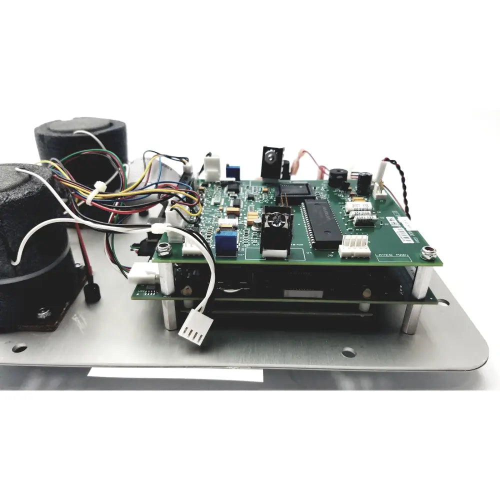 Green printed circuit board with black integrated circuits in the Covidien Genius 2 checker calibrator for reuse medical devices