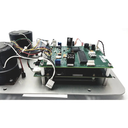 Green printed circuit board with black integrated circuits in the Covidien Genius 2 checker calibrator for reuse medical devices