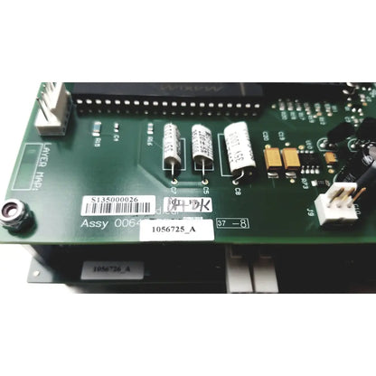 Green circuit board with white capacitors and black integrated circuits in covidien genius 2 checker calibrator for reuse medical use