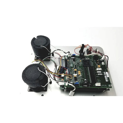 Black foam-covered speaker drivers on a green circuit board of covidien genius 2 checker calibrator for reuse medical use