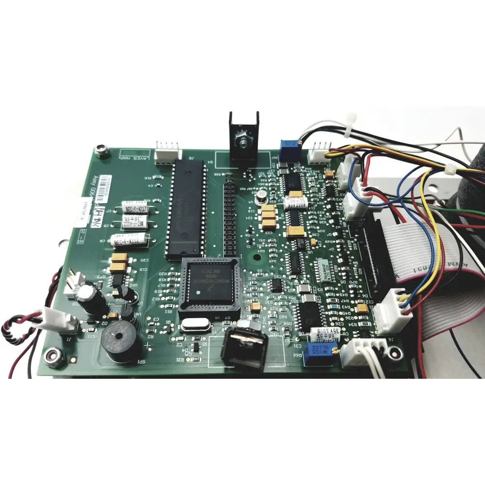 Green printed circuit board with black integrated circuits and capacitors in covidien genius 2 checker calibrator for test meters