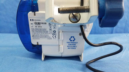Blue and white covidien kangaroo joey nutrition feeding pump with pole clamp and recyclable battery label visible