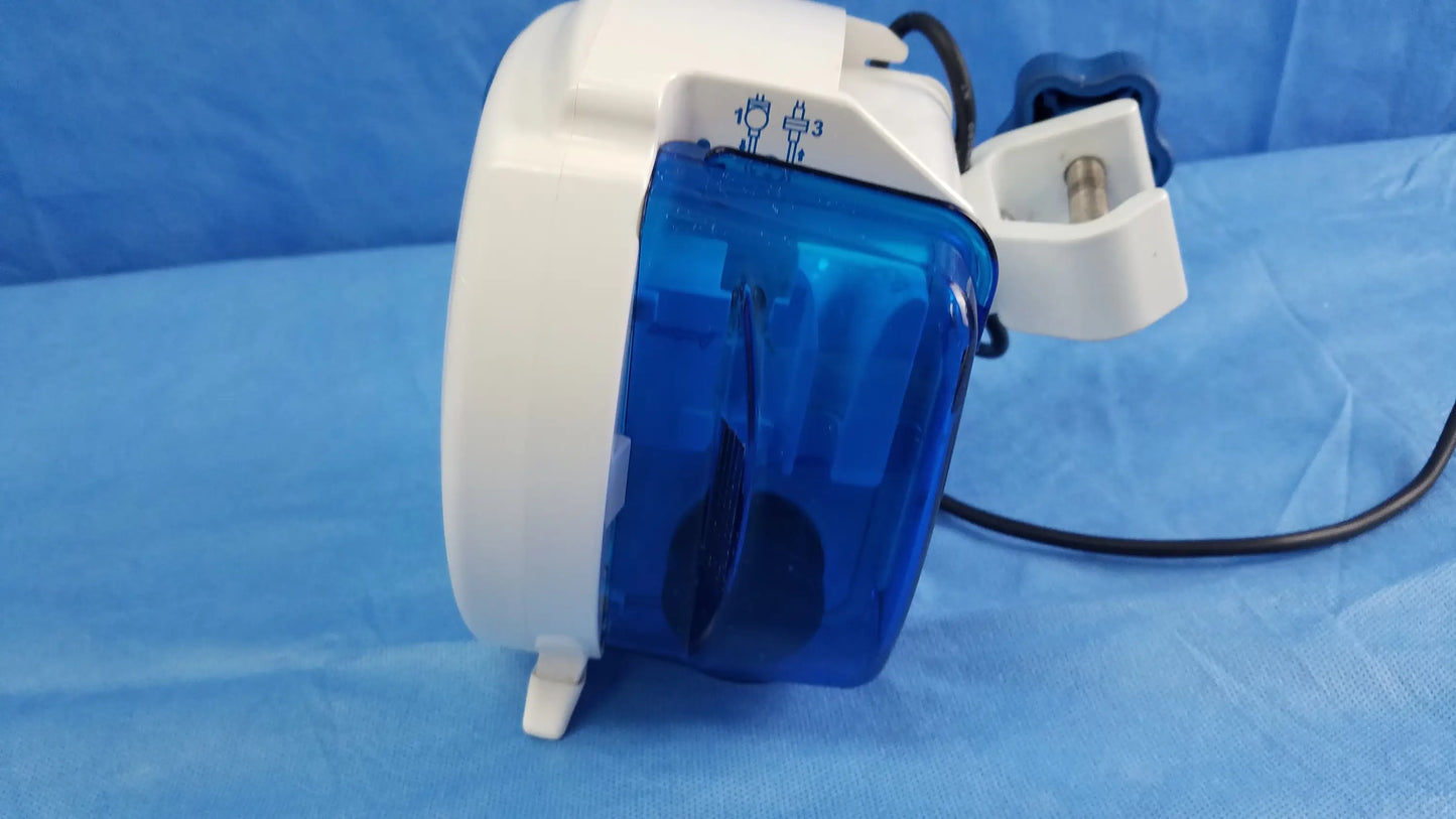 White and blue Covidien Kangaroo Joey nutrition feeding pump with transparent casing, white housing, black cable, pole clamp, and adapter