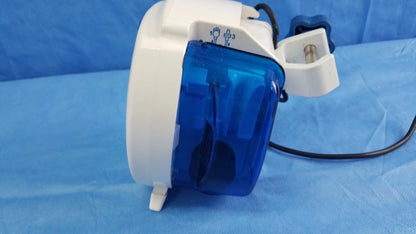White and blue Covidien Kangaroo Joey nutrition feeding pump with transparent casing, white housing, black cable, pole clamp, and adapter