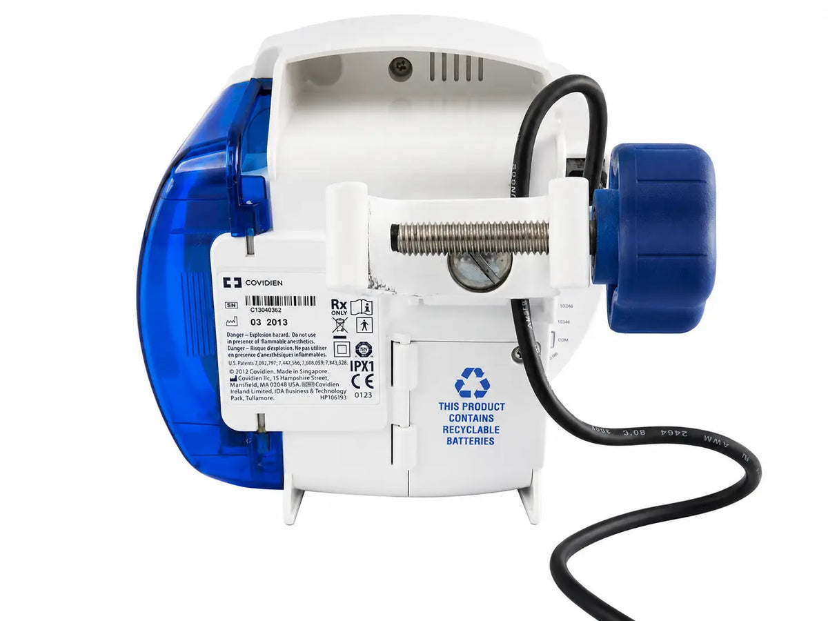 Covidien Kangaroo Joey nutrition feeding pump with white and blue casing, metallic screw, and black power cord