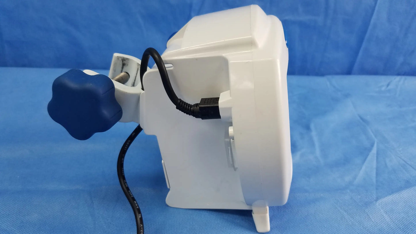 White plastic Covidien Kangaroo Joey nutrition feeding pump with blue star-shaped knob and black coiled cable accessory