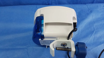 White and blue Covidien Kangaroo Joey nutrition feeding pump with clip-on pole clamp and power adapter for nutrition feeding