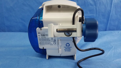 White and blue Covidien Kangaroo Joey nutrition feeding pump with curved plastic body, metal screw, and black cable attached