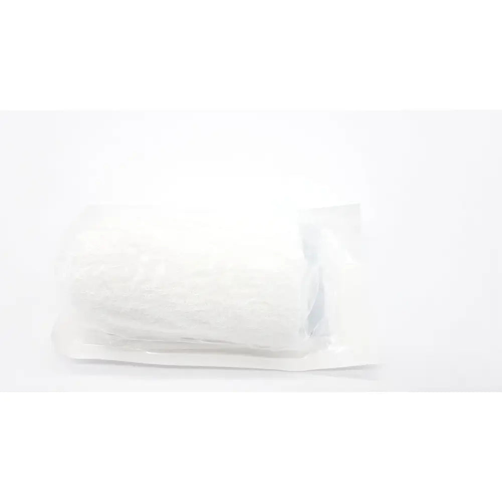 A white crinkled plastic-wrapped package containing a sterile covidien kerlix fluffy gauze bandage roll 6-ply 4.5 by 4.1 yds