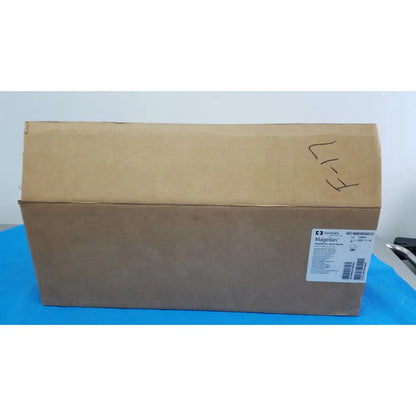 Brown cardboard box with a white label displaying covidien magellan hypodermic safety needle product details
