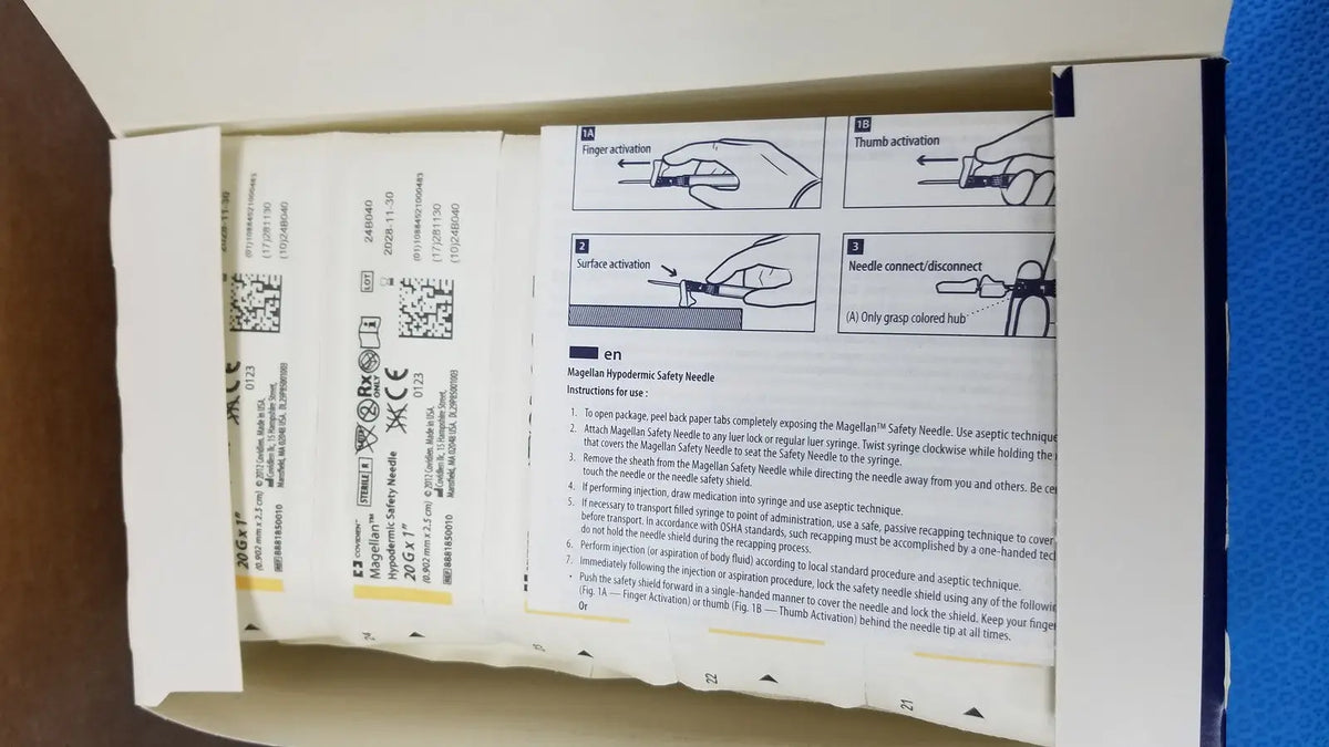 Covidien magellan hypodermic safety needles in a cardboard box with printed instructions and safety diagrams visible