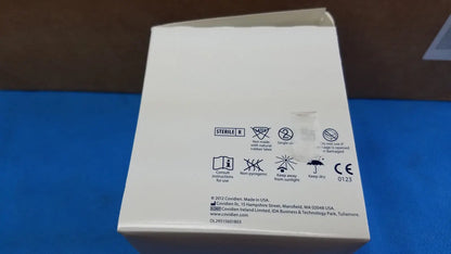 White cardboard box with black text and symbols showing sterile r and manufacturer info for covidien magellan hypodermic safety needle