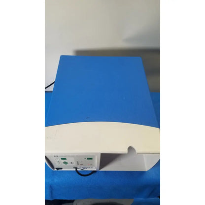 Blue and white covidien se3690 smoke evacuator medical device with control panel on the side for surgical smoke removal