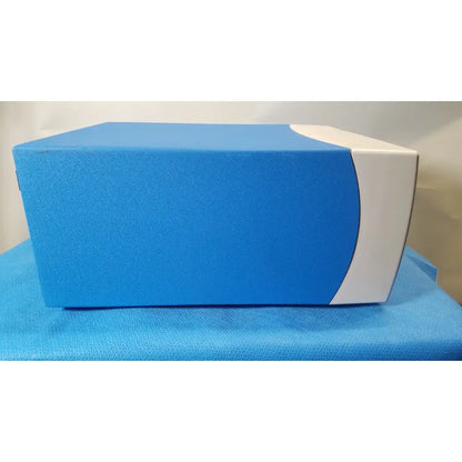 Blue and white rectangular covidien se3690 smoke evacuator with textured surface for surgical smoke management